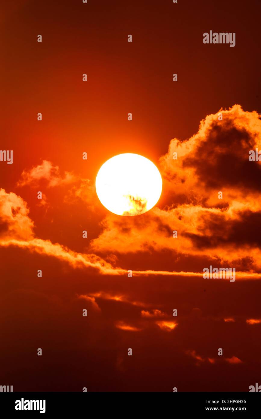 Sky with sun in clouds of altitude. Cloud the evening sky at sunset Stock Photo