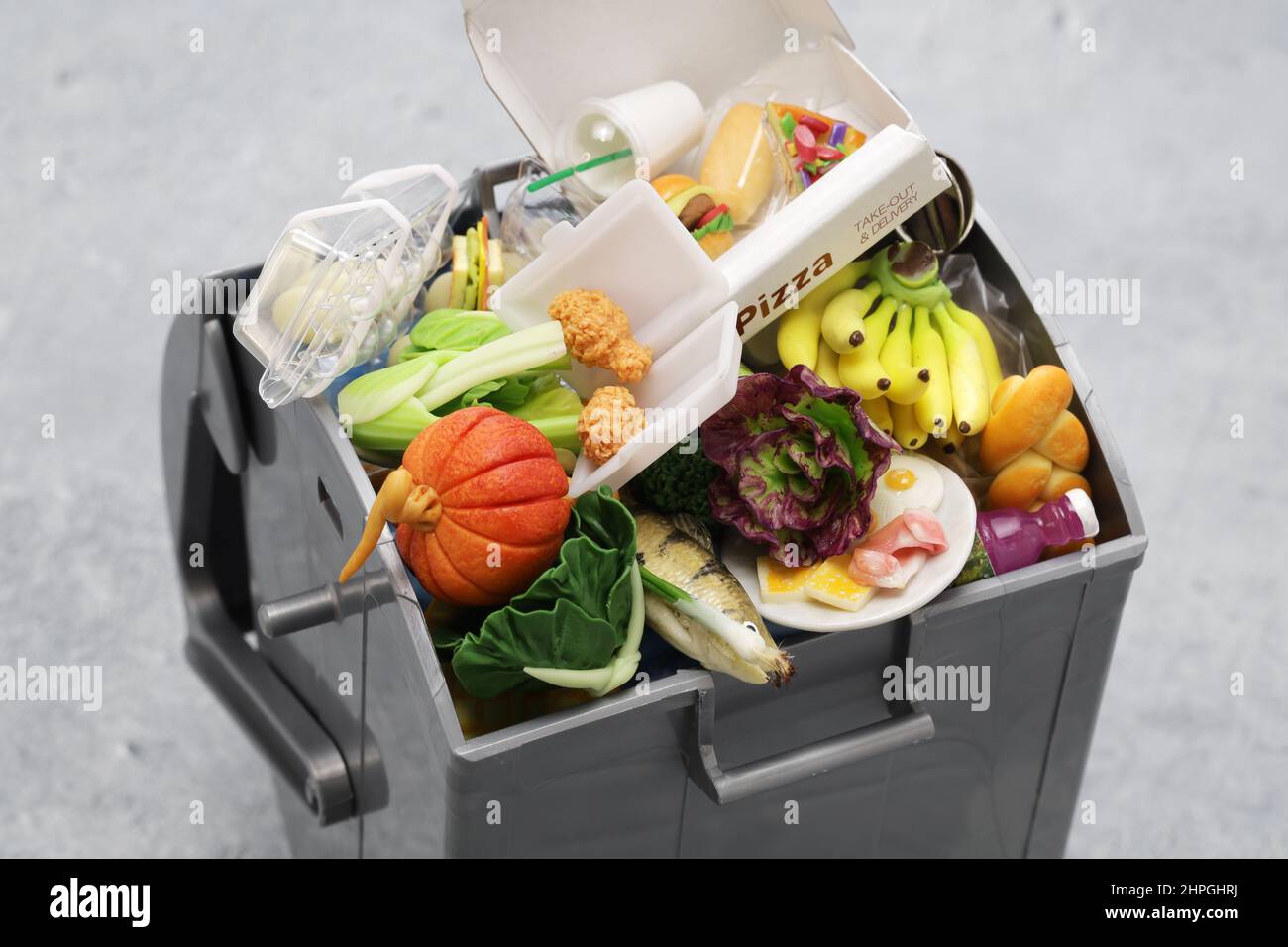 Garbage trash can, Image of food waste made in miniature. The letters