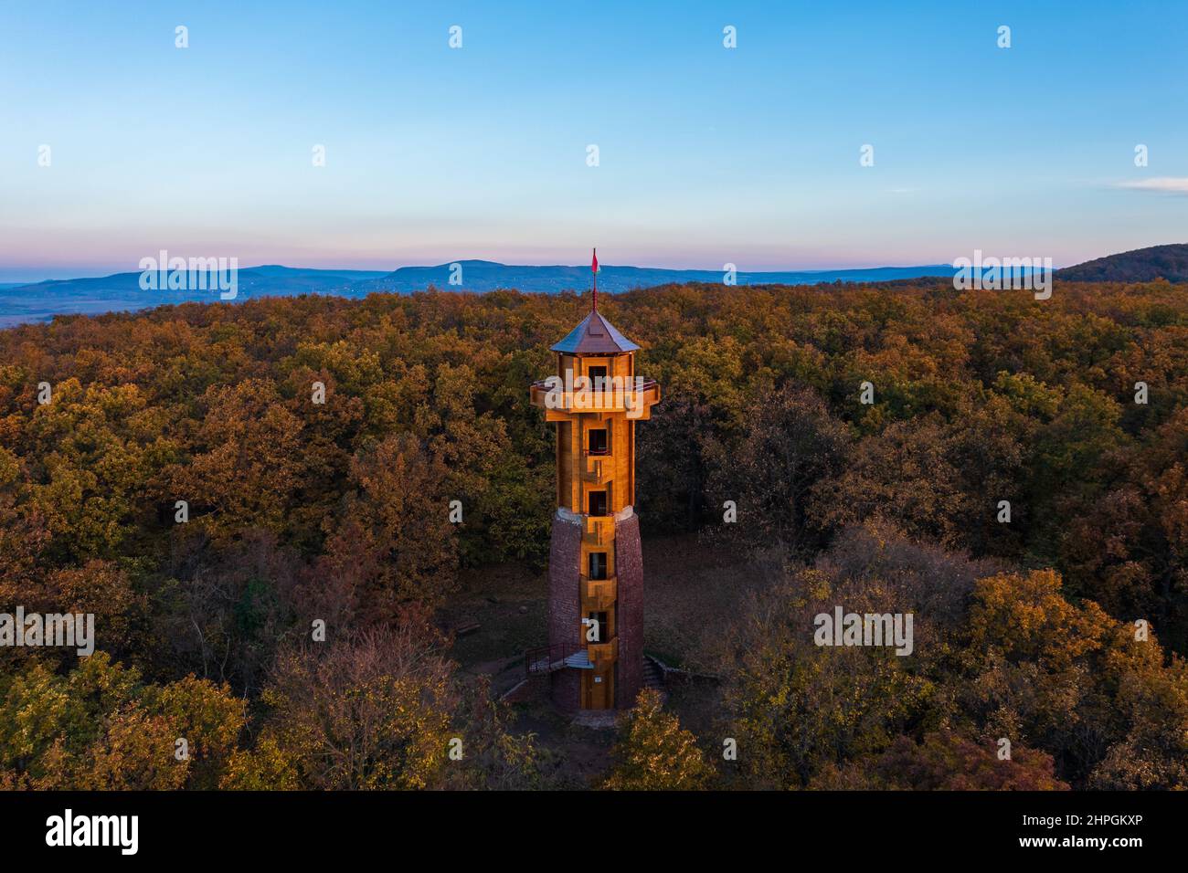 Aerial view about the freshly renovated lookout tower at Révfülöp. Cloudy autumn sunrise at the background. Hungarian name is Fülöp-hegyi kilátó. Stock Photo