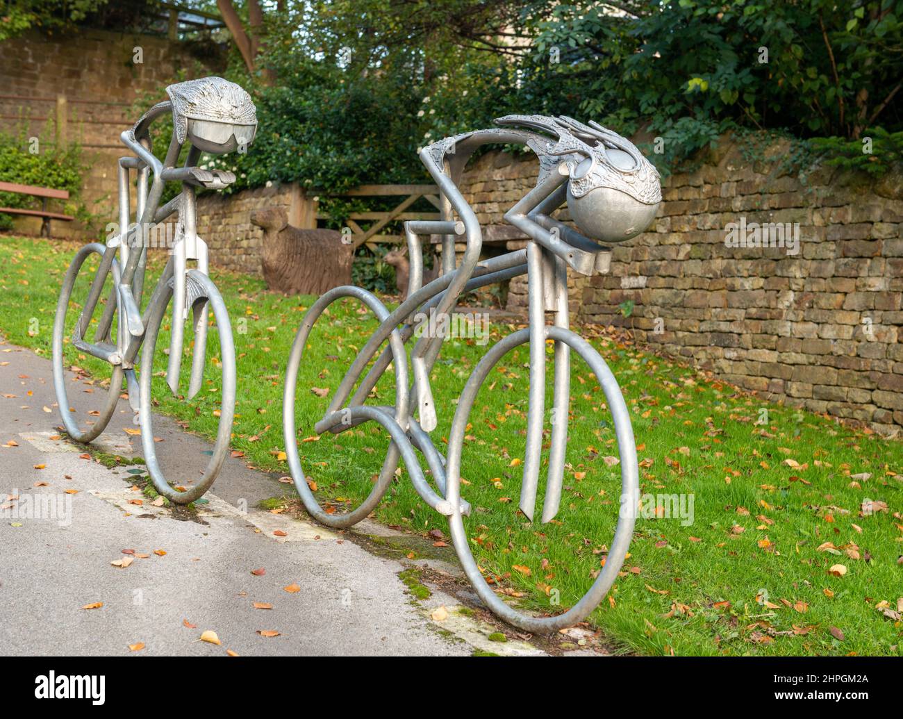 Metal sculpture of two racing cyclists commemorating the 2014 visit of the Tour de France to Knaresborough in North Yorkshire Stock Photo