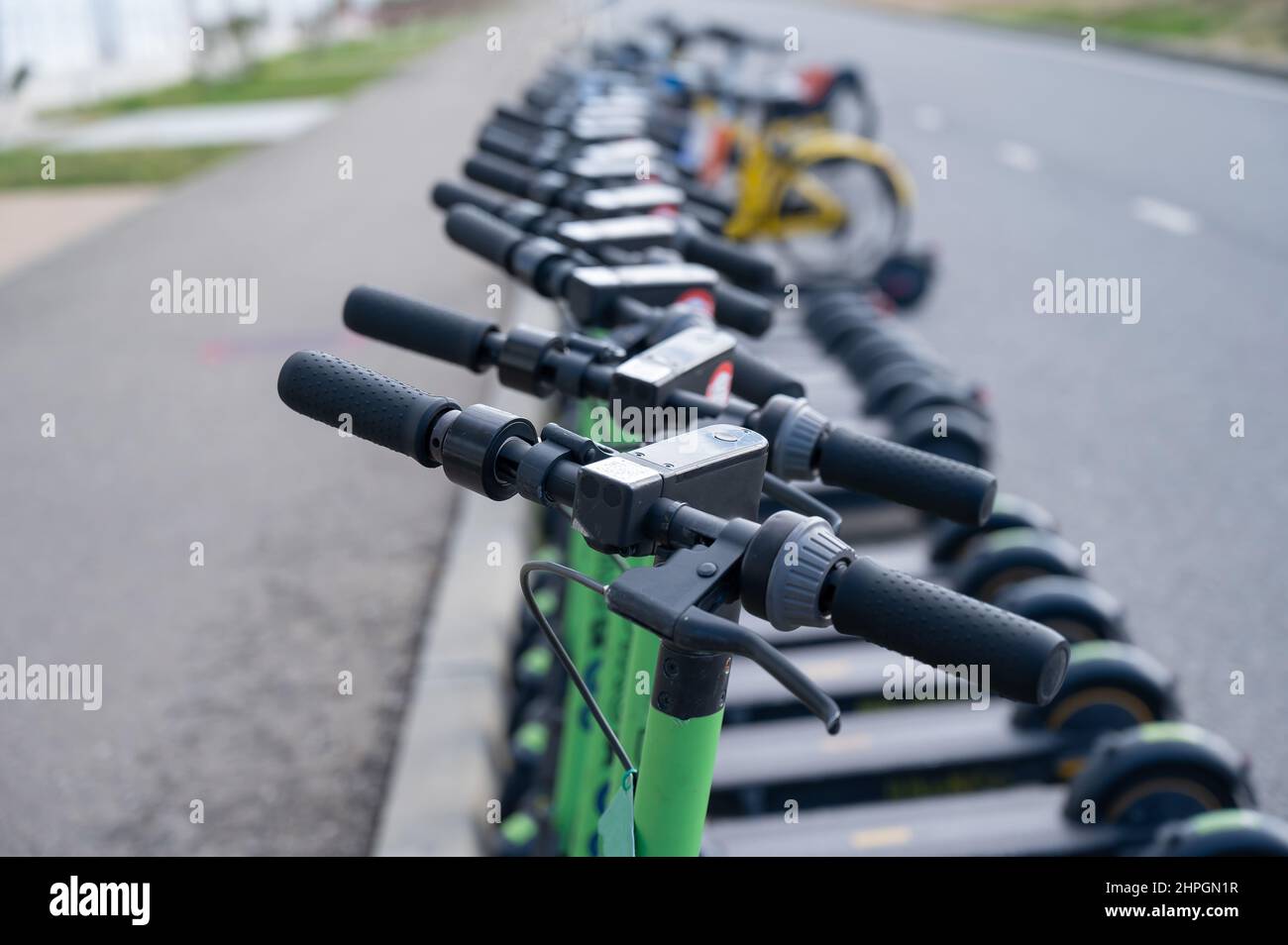 05.02.2022 Sochi, Russia: Row of electric scooters for rent outdoors. Stock Photo