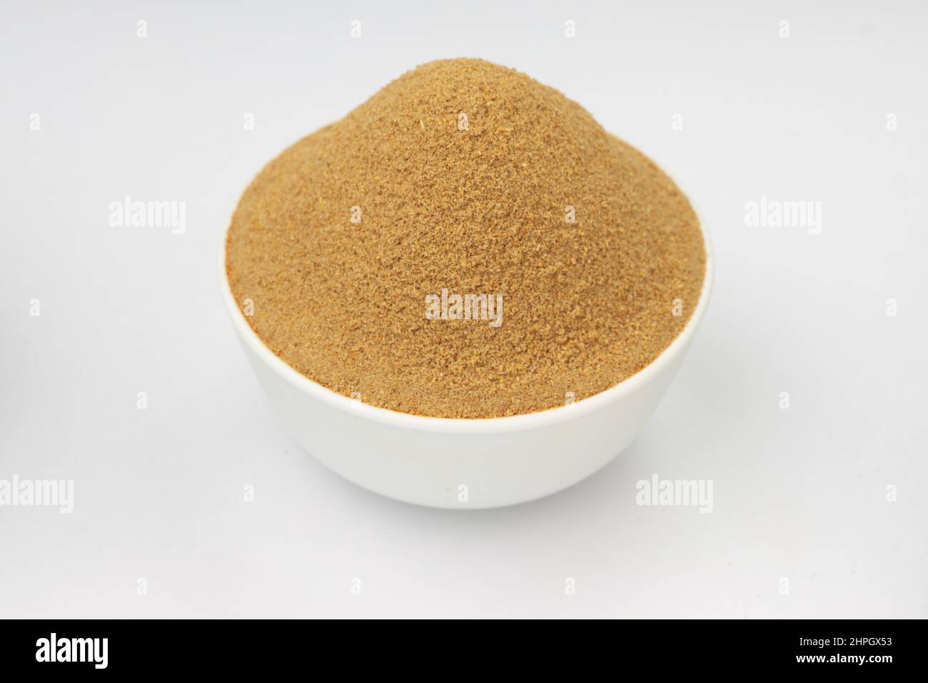 Coriander powder ,indian spice ; main ingrediant for indian dishes ,arranged in a white bowl on