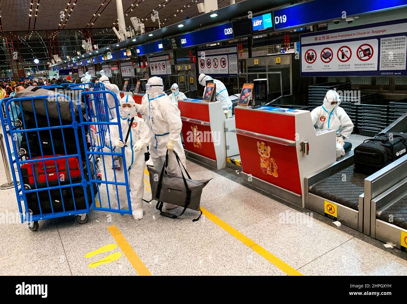 airport-staff-at-beijing-airport-wearing-personal-protective-equipment