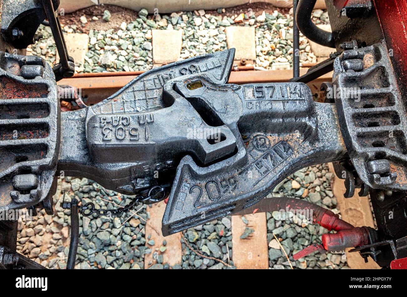 Close up of a train car coupler joint. Train car coupler joint trains