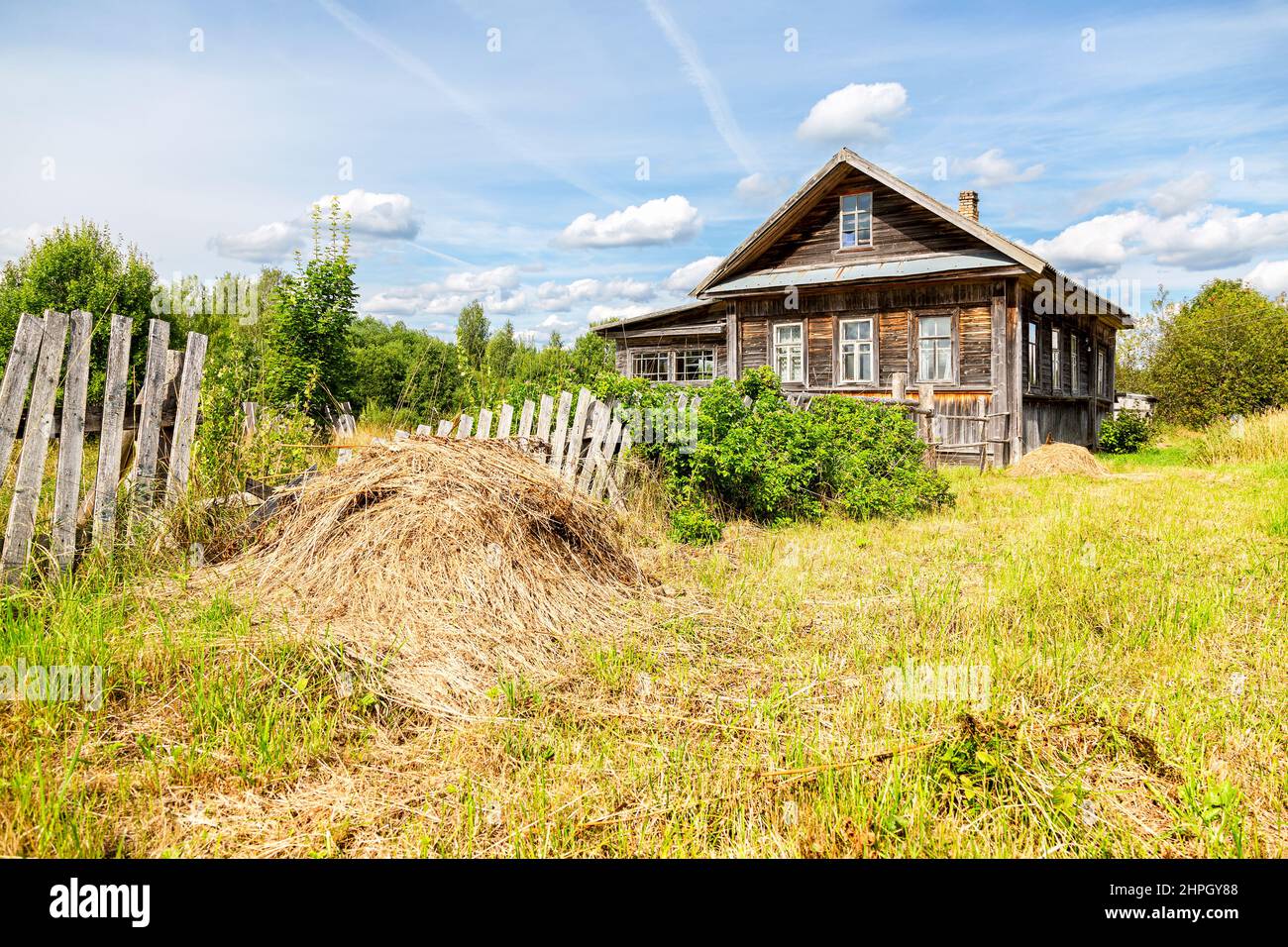 Old abandoned rural wooden house in russian village in summer sunny day ...
