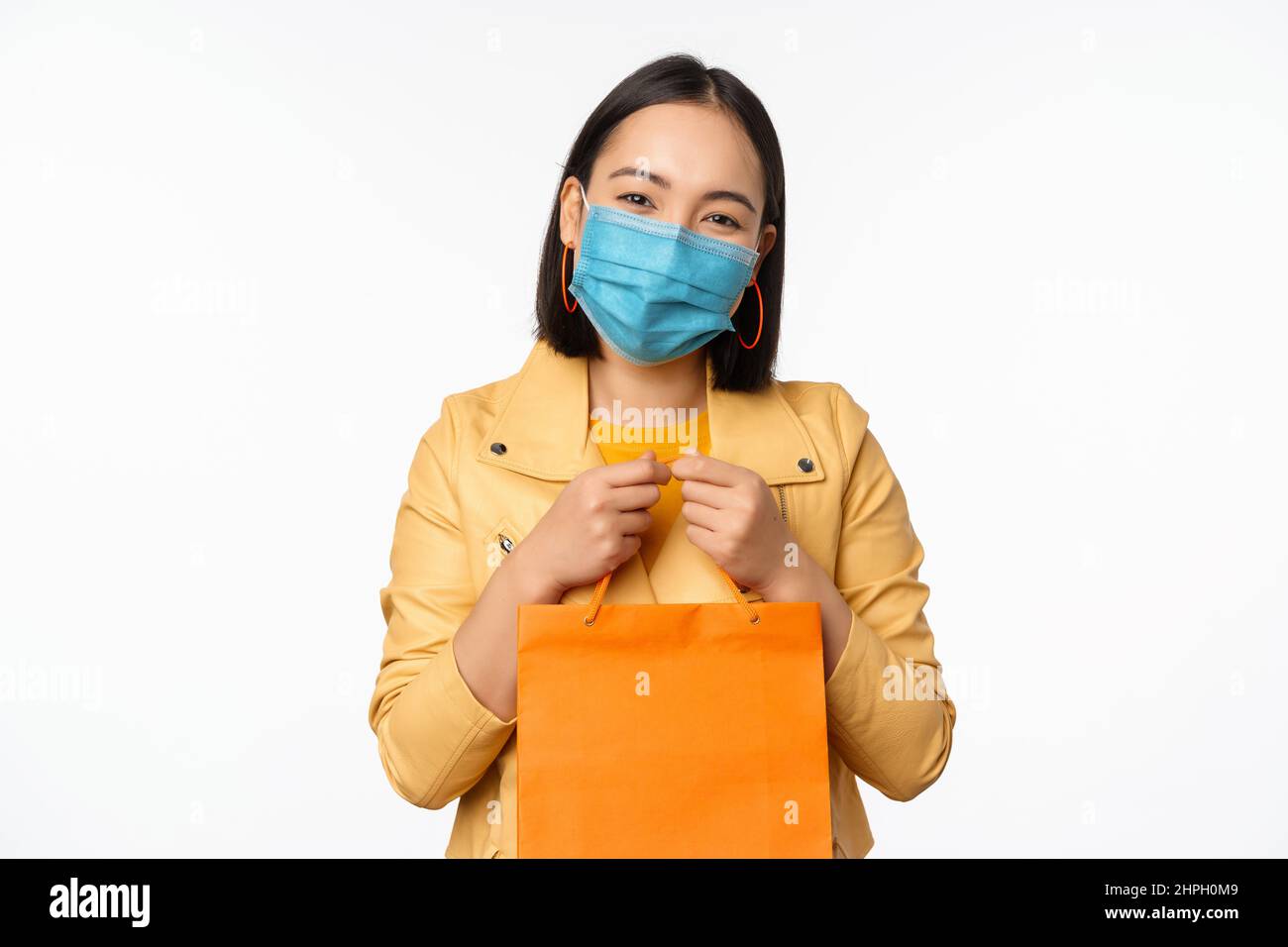Covid19 and shop concept. Young asian stylish woman, wearing medical