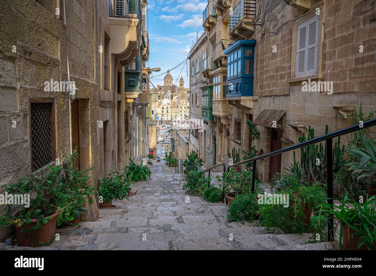 Narrow street with stairs in Valletta, Malta Stock Photo