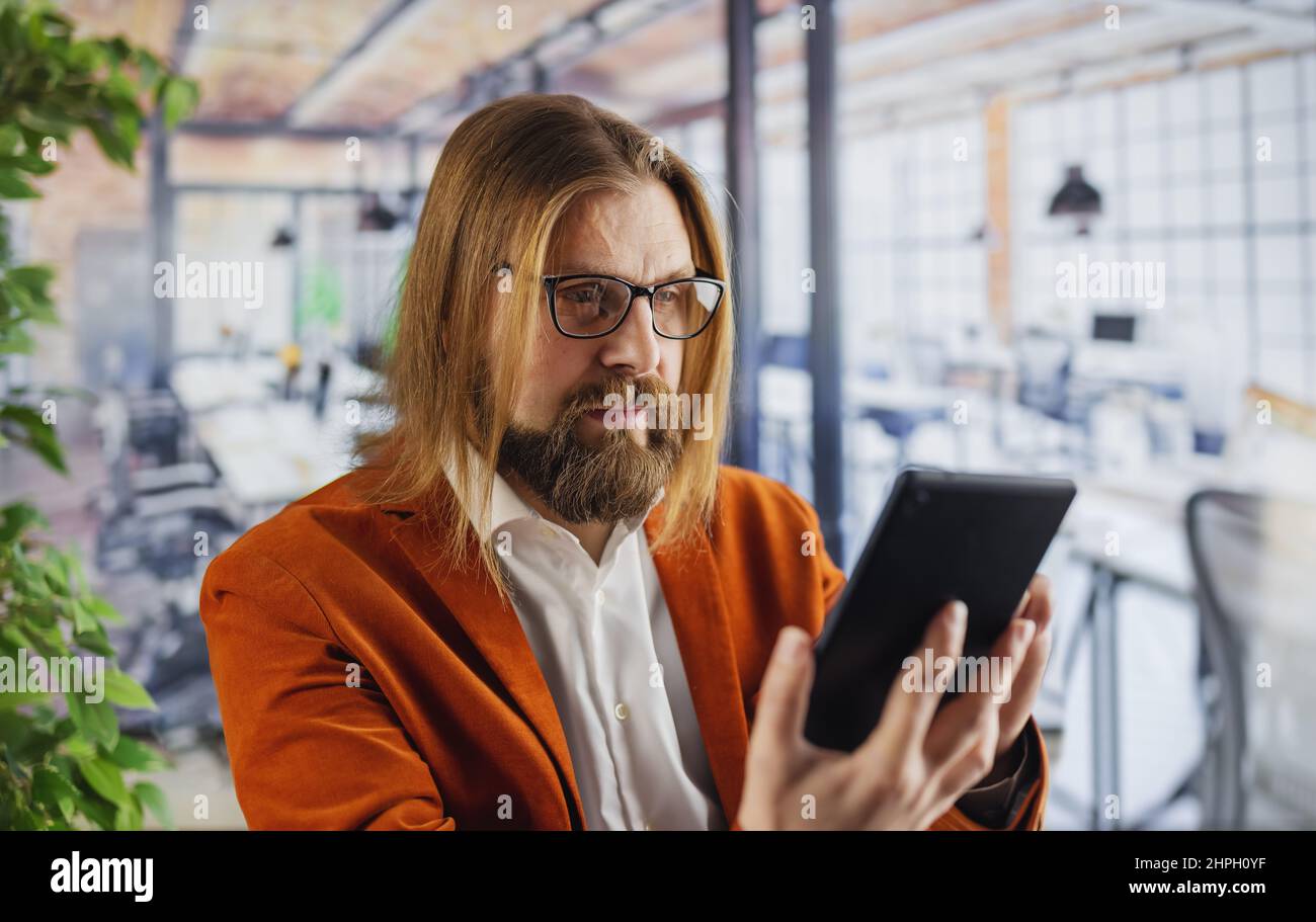 Man using tablet at office Stock Photo