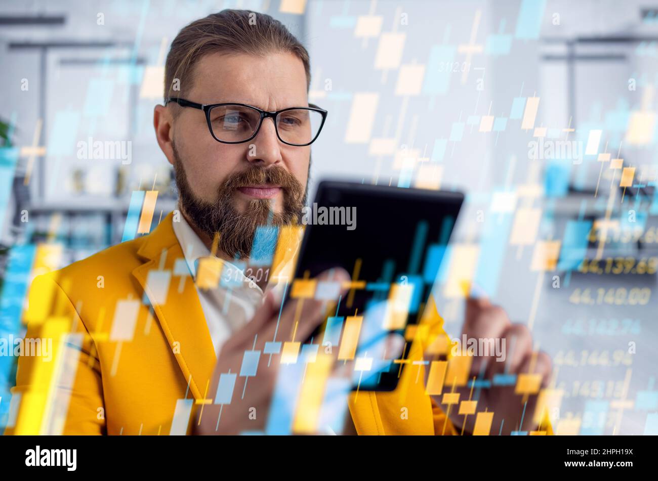 Crypto trader using tablet Stock Photo