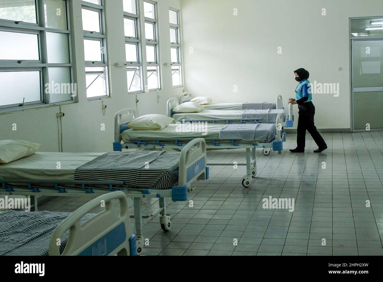 An officer seen cleaning the isolation room during a simulation of ...