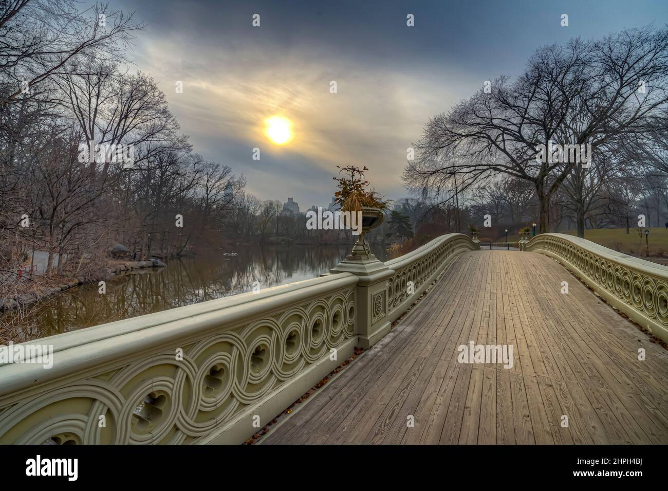Bow bridge, Central Park, New York City early morning with dramatic sky