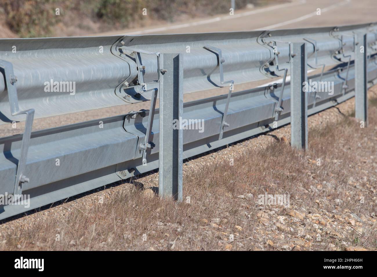 Guardrails poles covered crash-absorber beam. Roadside view. Motorists safety concept Stock Photo
