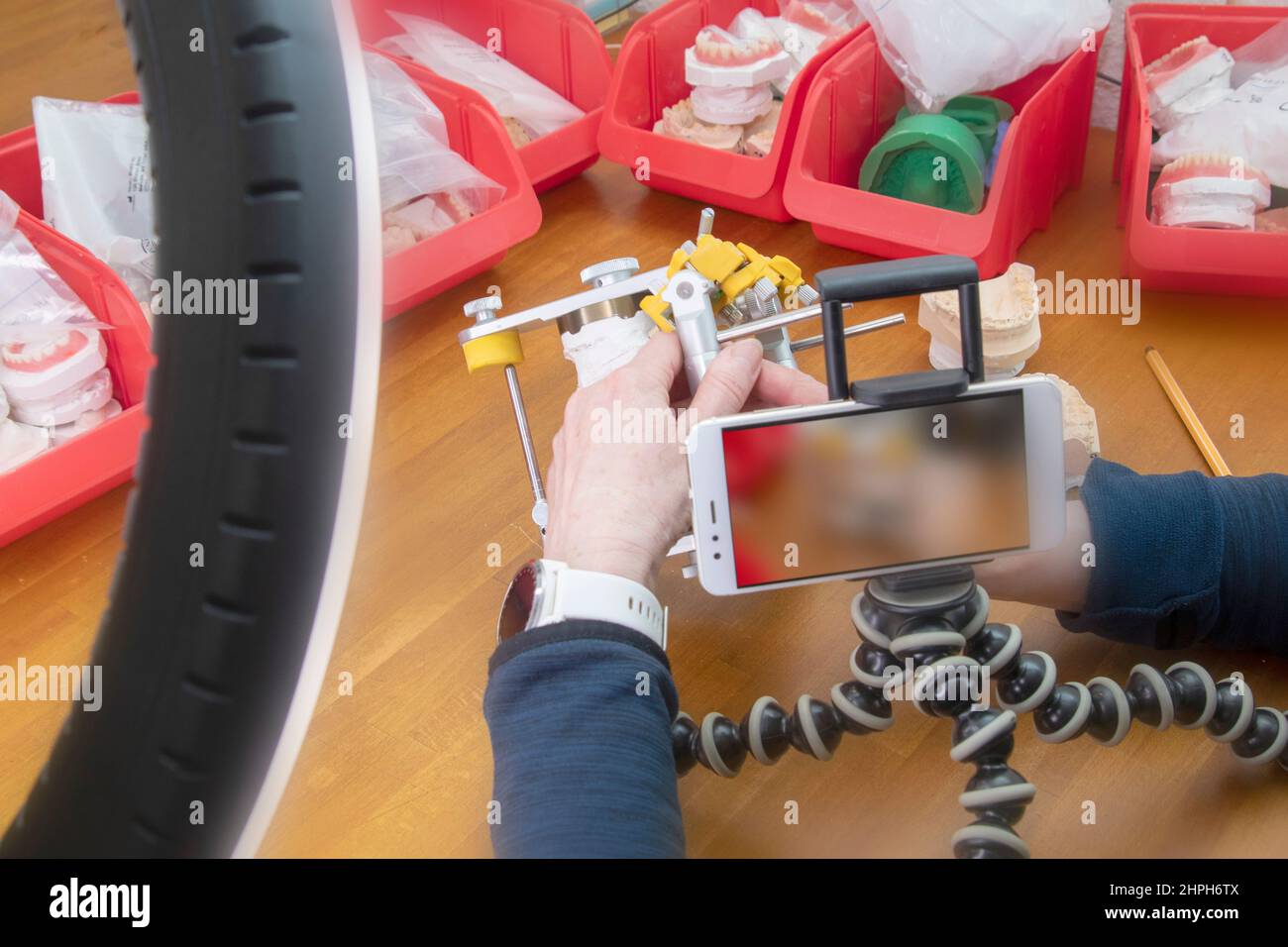 dental technology online video conference with articulator Stock Photo