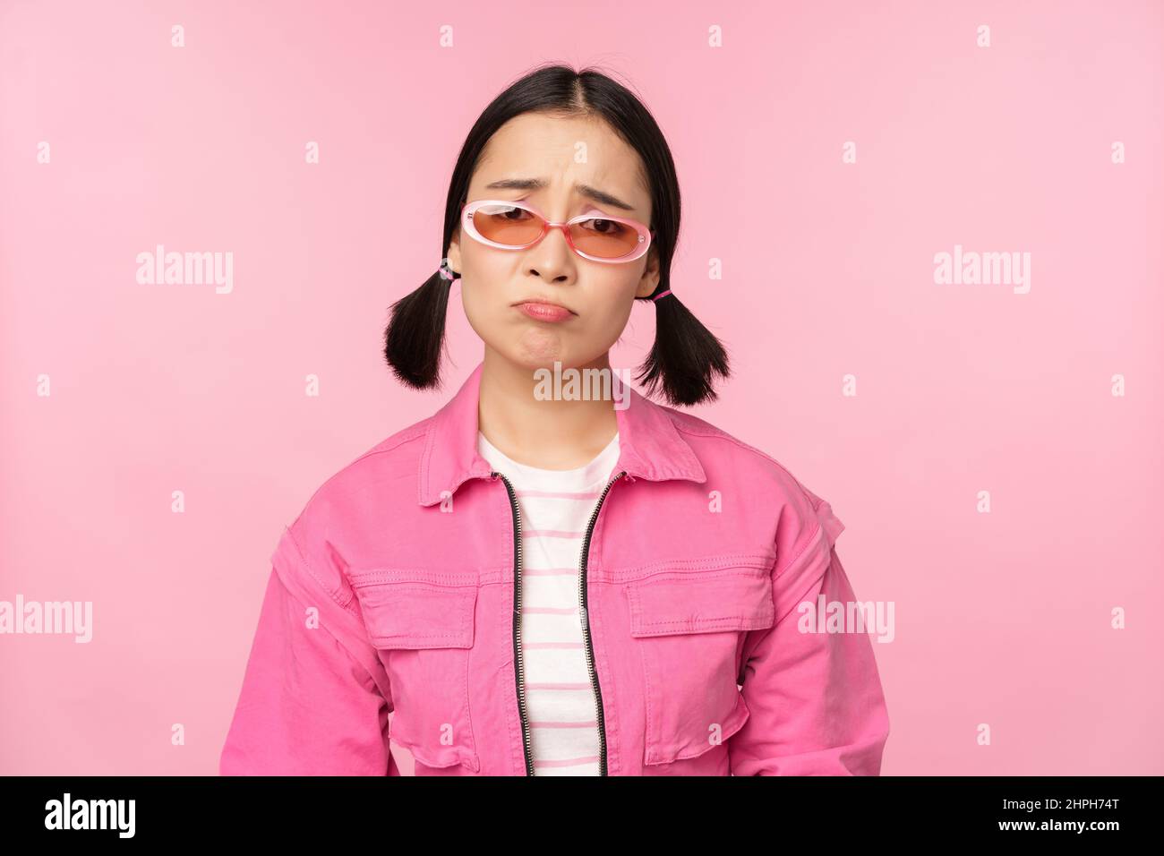 Portrait of sad and gloomy asian girl sulking from disappointment ...