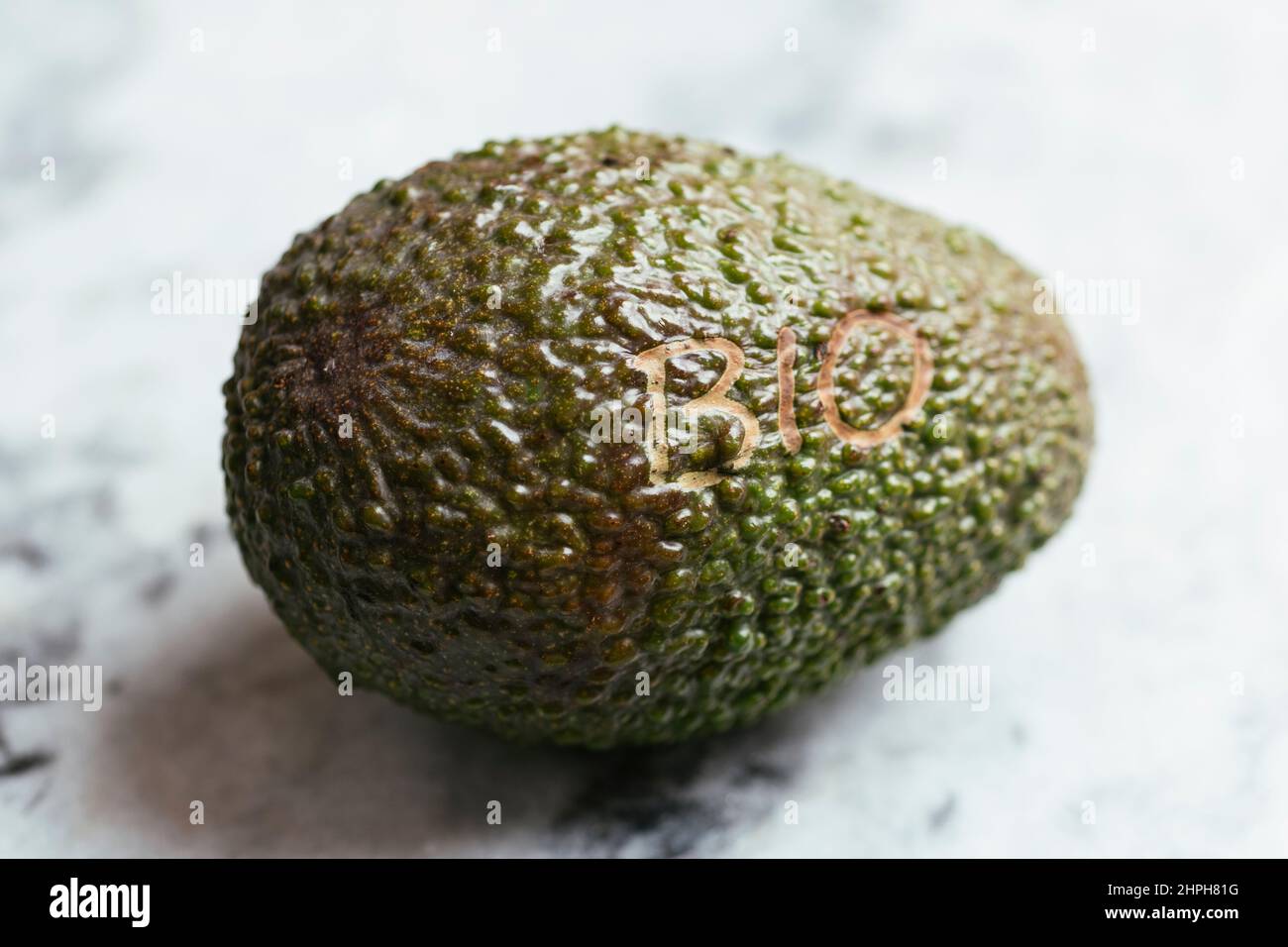 Organic avocado fruit with the word bio on it. Stock Photo