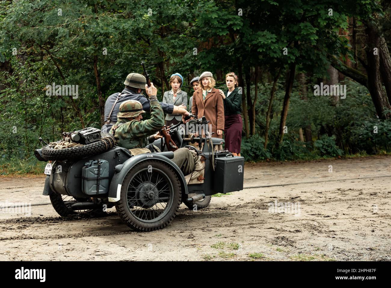 Hel, Pomerania, Poland- August 27, 2021: Historical reconstruction.  Second World War. France, German occupation.  German wehrmacht soldiers checking Stock Photo