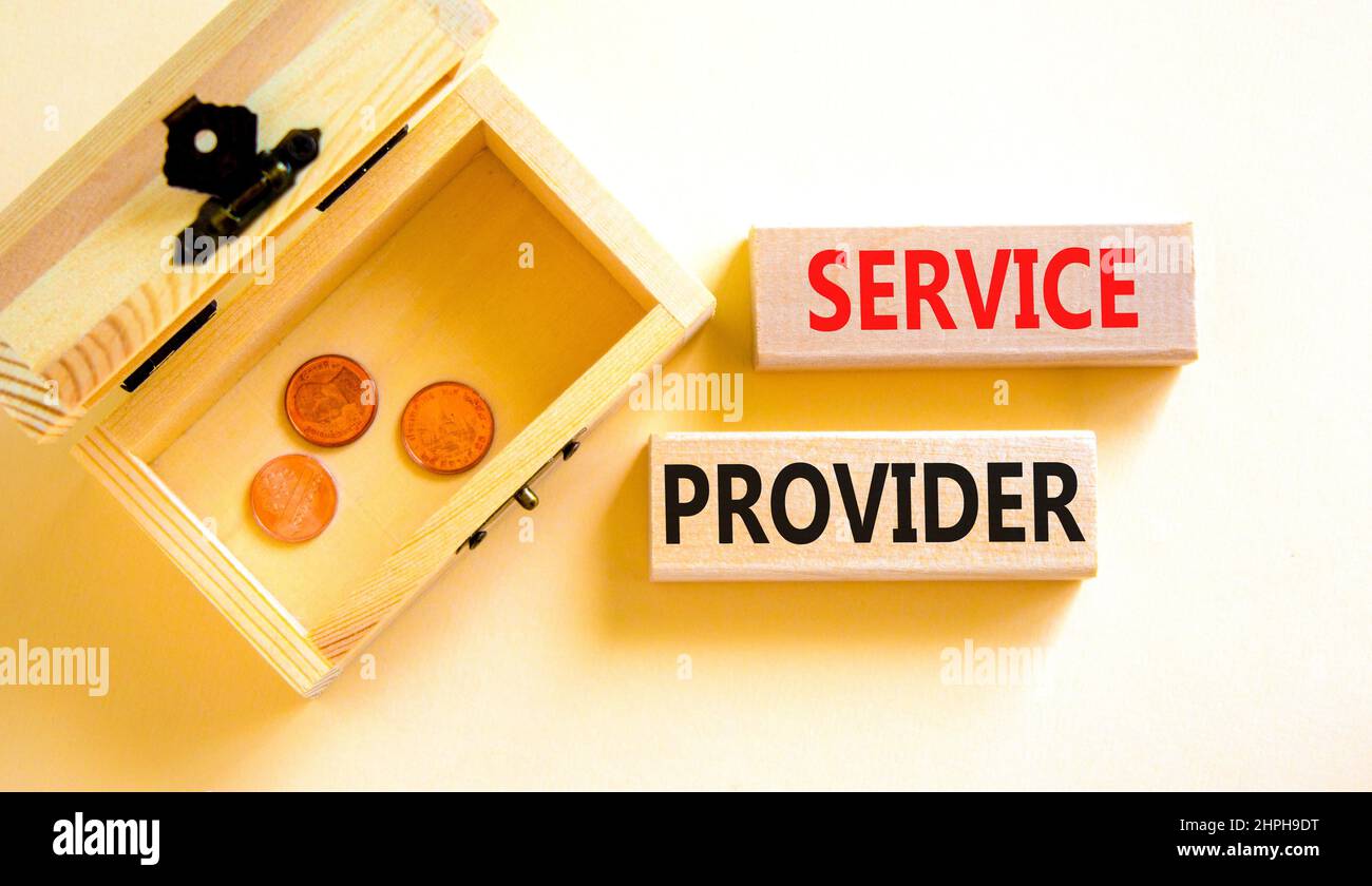 Service provider symbol. Concept words Service provider on wooden blocks on beautiful white table white background. Wooden chest with coins. Business Stock Photo