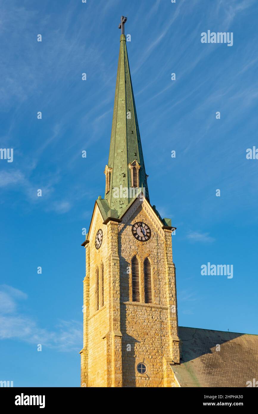 Old stone church in the Midwest with brilliant blue skies in the