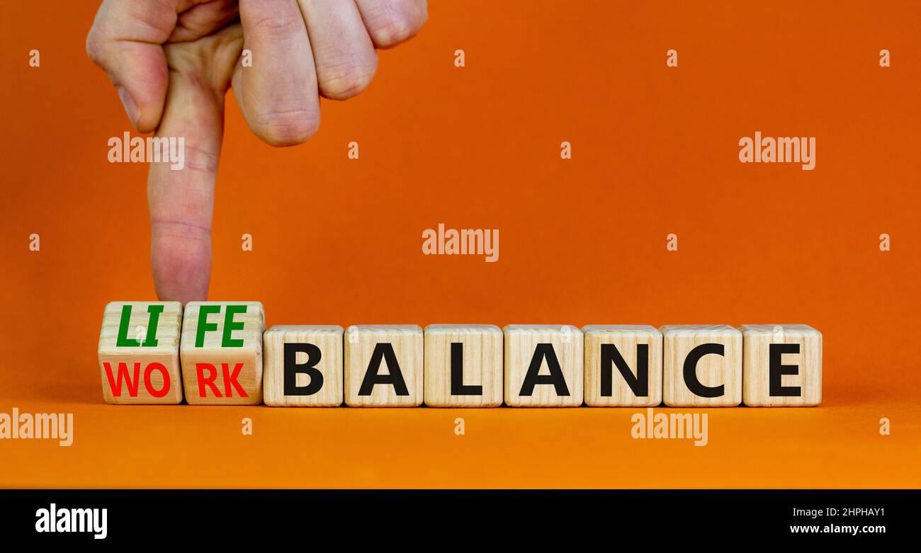 Work life balance symbol. Businessman turns cubes and changes concept ...