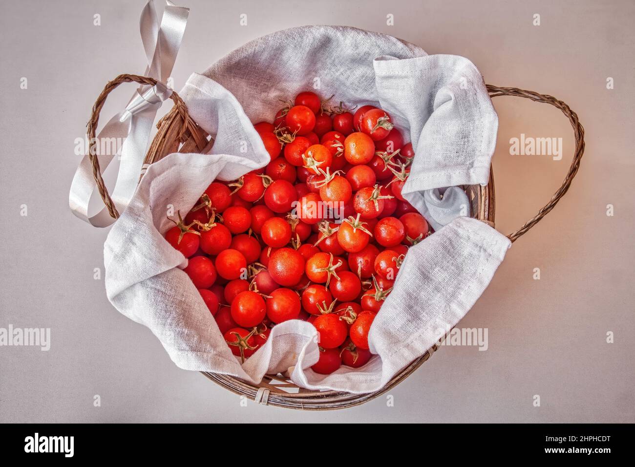 Basket with cherry tomatoes Stock Photo - Alamy