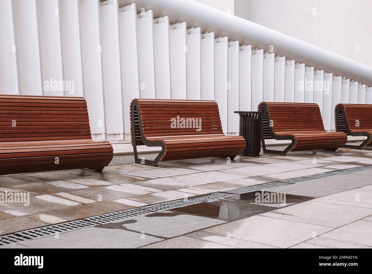 Modern benches in the city square . City improvement, urban planning, public spaces, modern urban design Stock Photo
