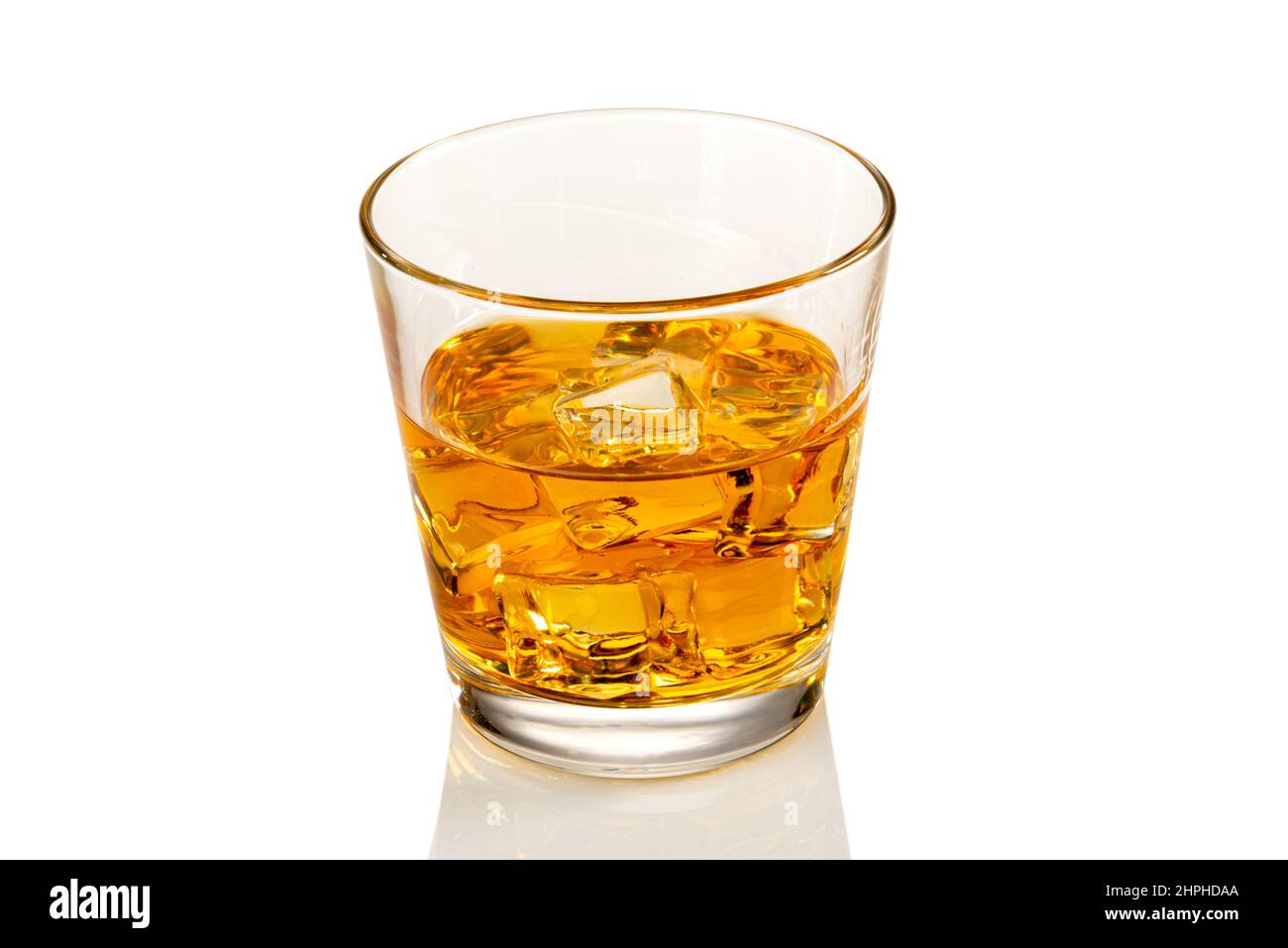 Glass of whiskey or whisky or bourbon or scotch, with ice cubes, closeup isolated on white, clipping path Stock Photo