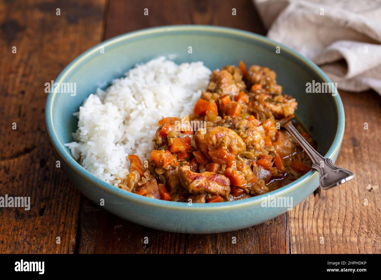 Pork and cider stew with rice Stock Photo
