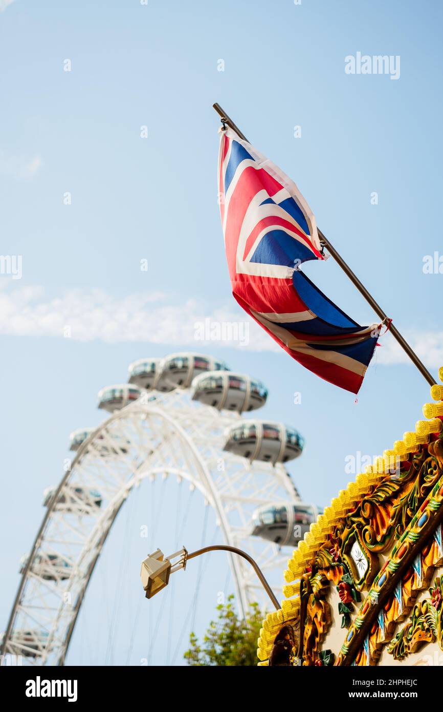 London, UK - September 13, 2019 : London Eye with the Union Jack along the Thames river Stock Photo