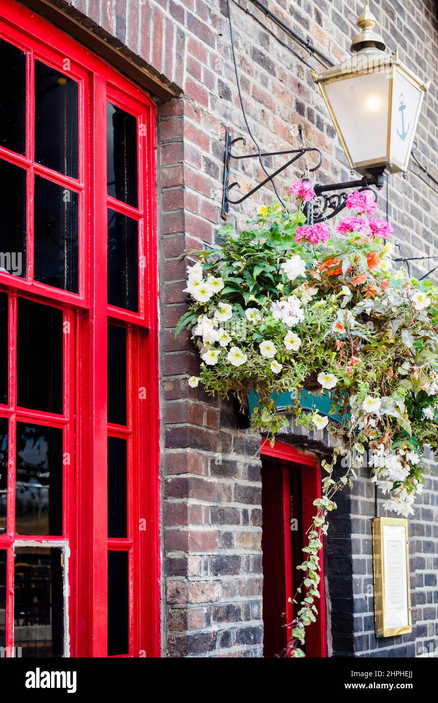 Classic flowered facade of a London pub, UK Stock Photo