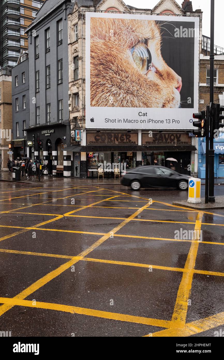 Box junction near Old Street in London UK. In the background an advert for an iPhone can be seen featuring a cat. Stock Photo