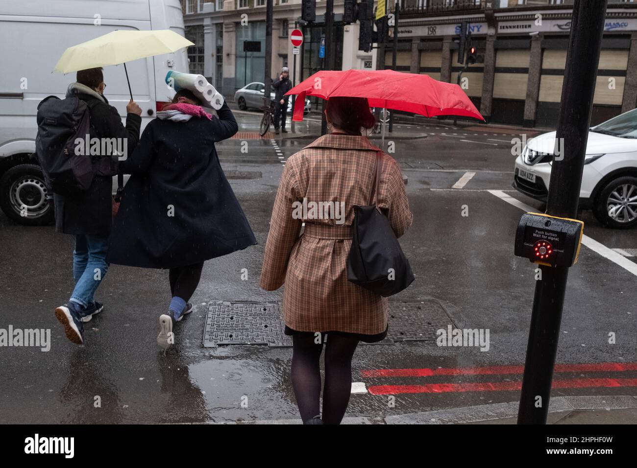 Brollies up, its another wet and windy day in London UK Stock Photo