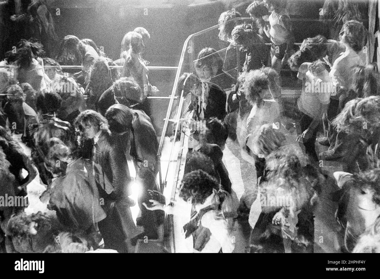 1973 photograph. Freaking out to psychodelic rock music on the dance floor in a smokey Hamburg , Germany discotheque. Stock Photo