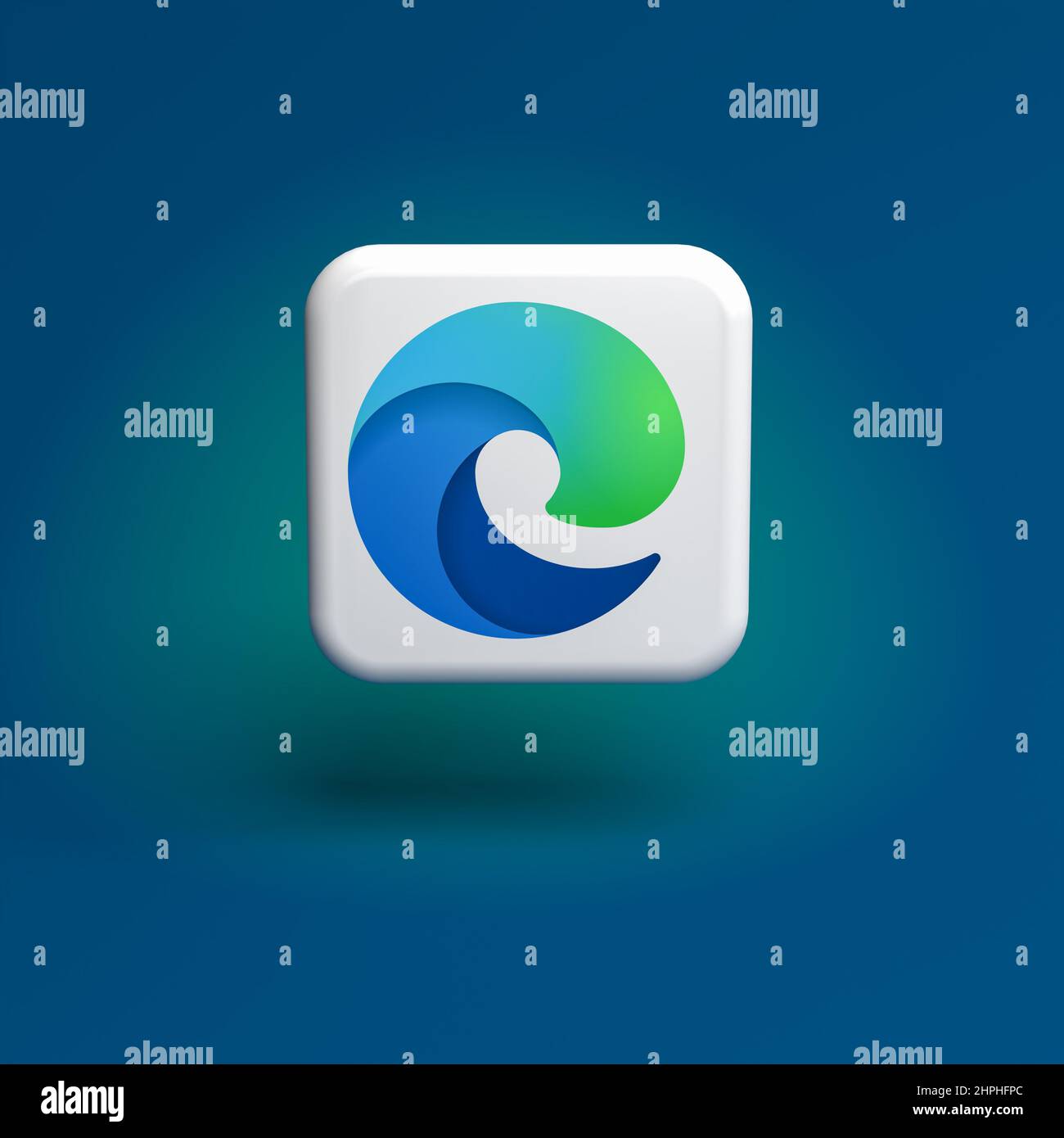 Logo of the Microsoft browser Edge app on a tile hovering over a seamless blue green background Stock Photo