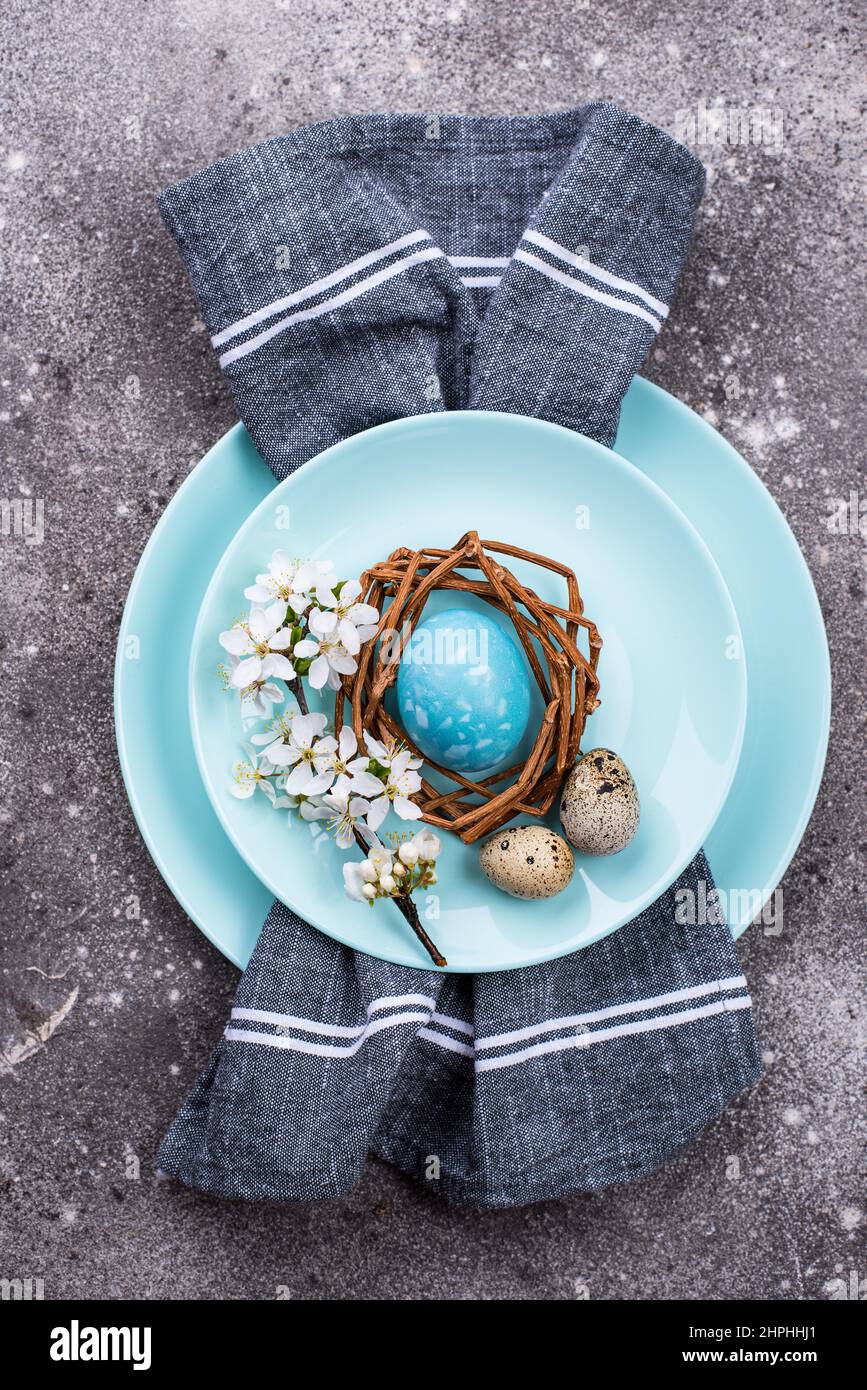 Easter table setting with blue egg Stock Photo