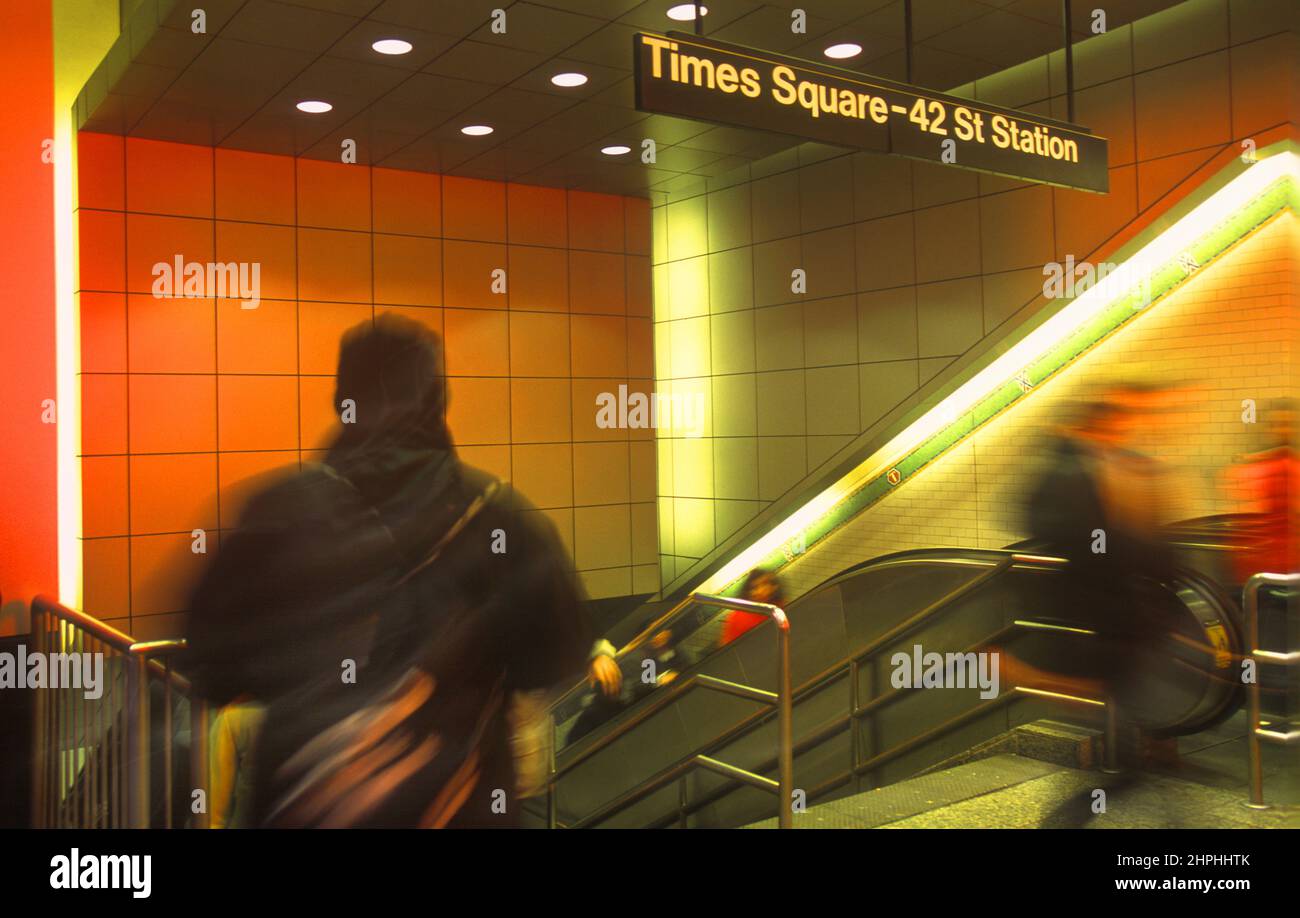 Subway escalator Times Square. Motion. Underground station interior in New York. Businesspeople rushing to work Midtown Manhattan, New York City USA Stock Photo