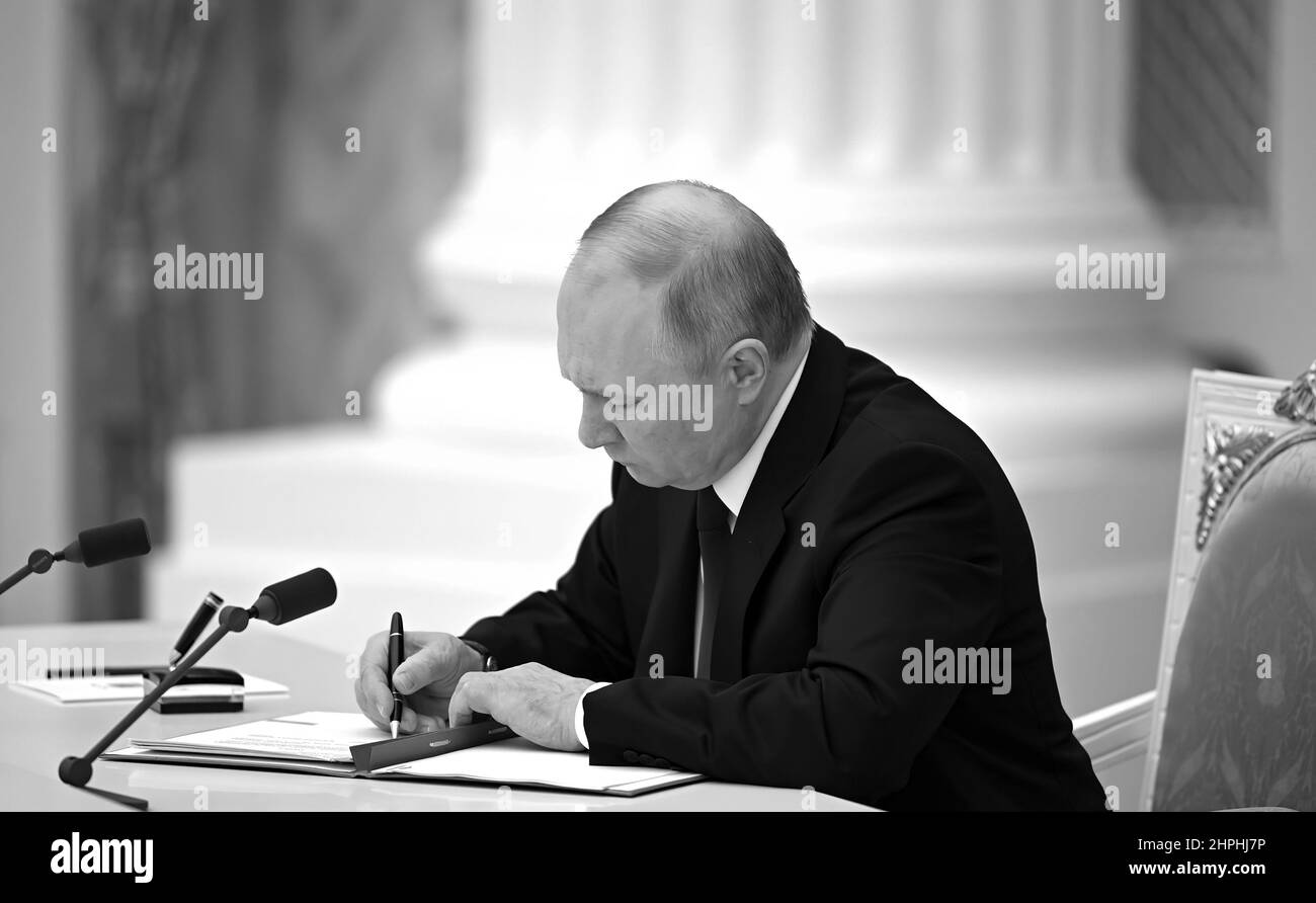 Russian President Vladimir Putin signs documents recognizing Donetsk and Lugansk People’s Republics as independent states.. Donetsk and Lugansk are breakaway regions of Ukraine. Stock Photo