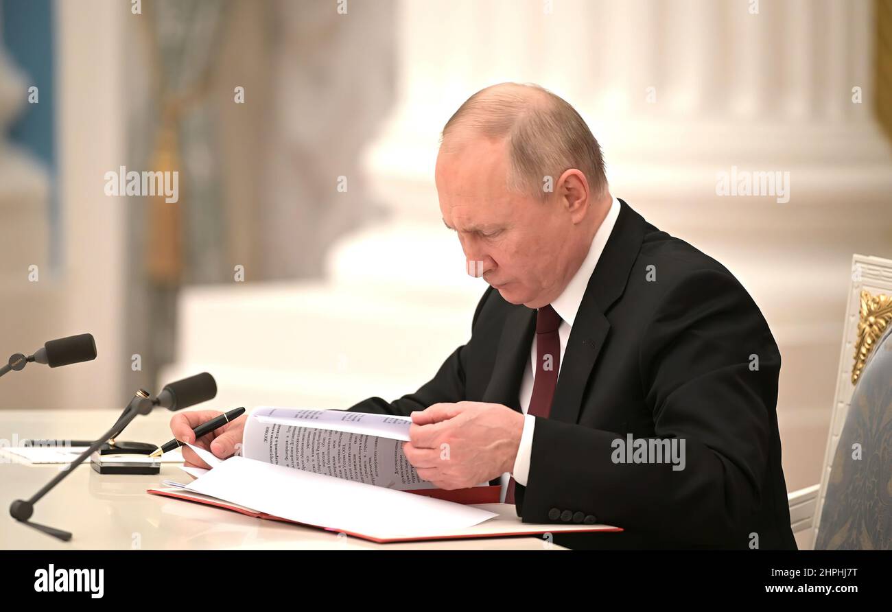 Russian President Vladimir Putin signs documents recognizing Donetsk and Lugansk People’s Republics as independent states.. Donetsk and Lugansk are breakaway regions of Ukraine. Stock Photo