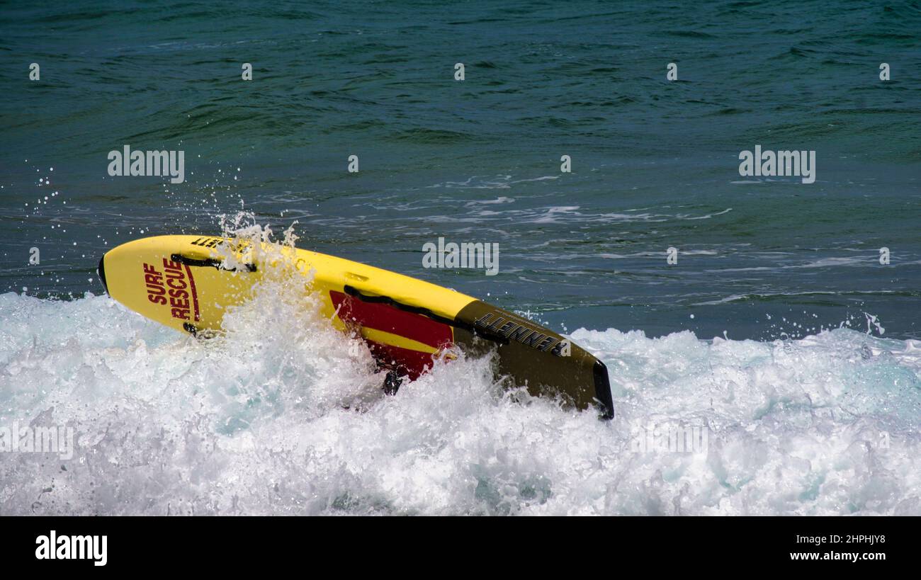 Sydney, New South Wales Australia - December 26 2021: Lifesaver washed off her surfboard at Mona Vale Beach Sydney Stock Photo