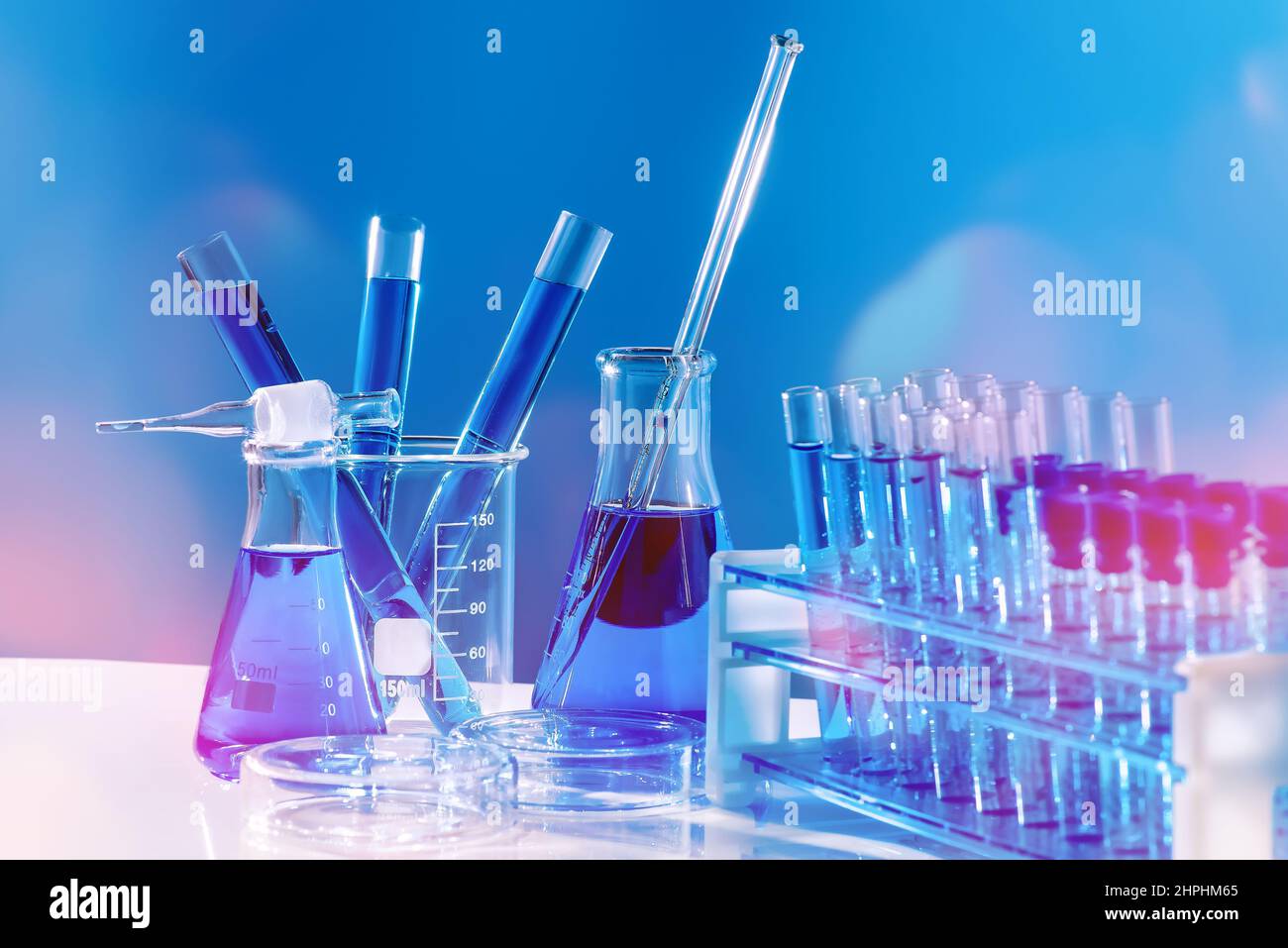 Collection of medical flasks on a blue background.Science glass flask ...