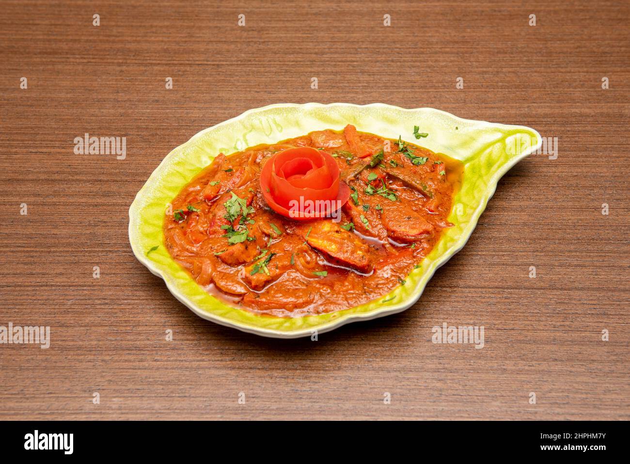 Jalfrezi is a typical Indian curry made from minced meat and vegetables, usually peppers, onions and tomatoes, and spices. Stock Photo