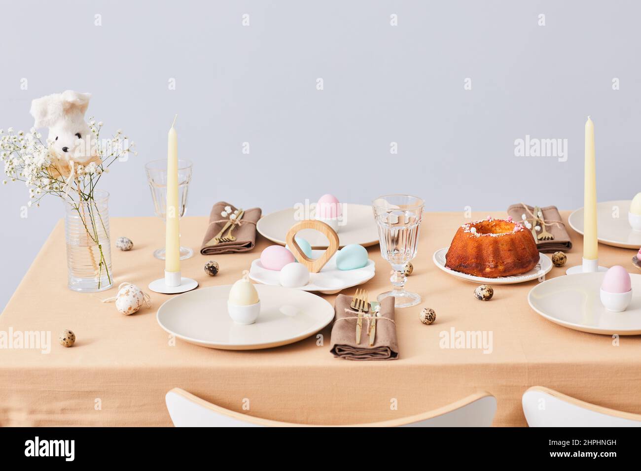 Minimal background image of elegant dinner table decorated for Spring and Easter, copy space Stock Photo