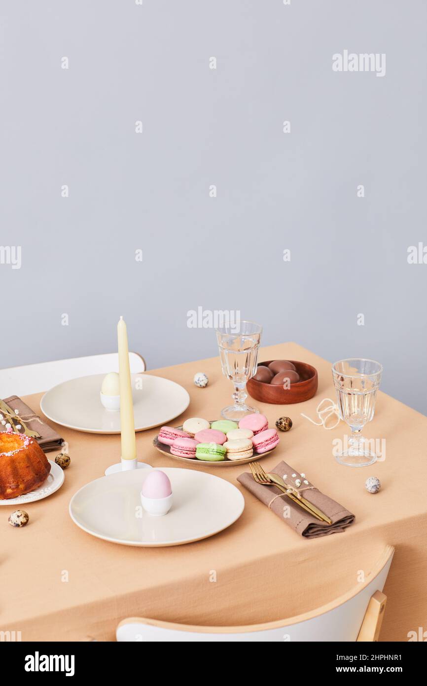 Vertical background image of elegant dinner table decorated for Easter and Spring, copy space Stock Photo