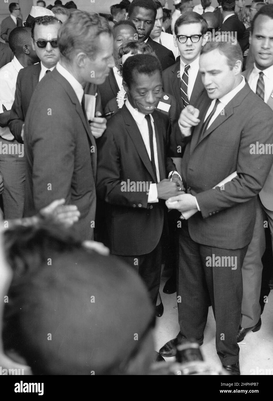 Civil Rights March on Washington, D.C. [Author James Baldwin with actors Marlon Brando and Charlton Heston.], 08/28/1963 ca.  28 August 1963 Stock Photo