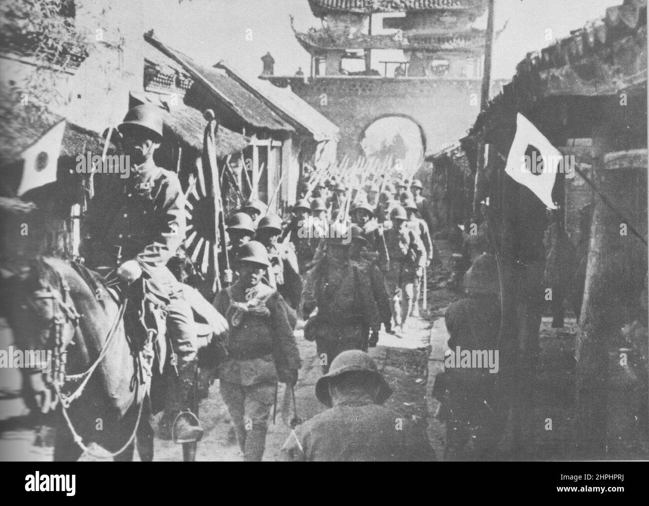 Japanese troops occupying a Chinese town in Anhwei province ca.  1938 Stock Photo