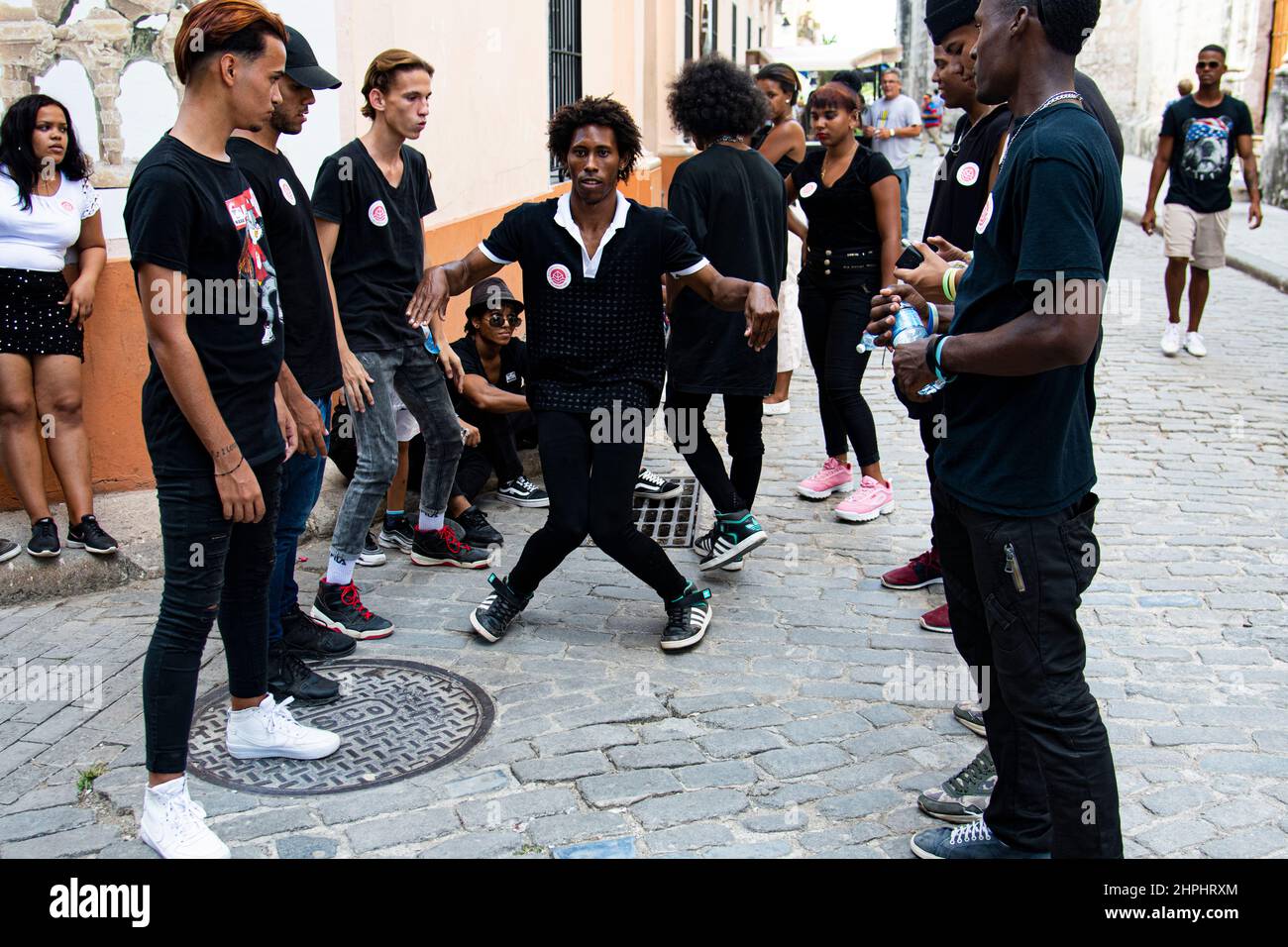 A group of young Cuban Hip Hop dancer's have a little fun practicing their moves on a street in Havana, Cuba. Stock Photo