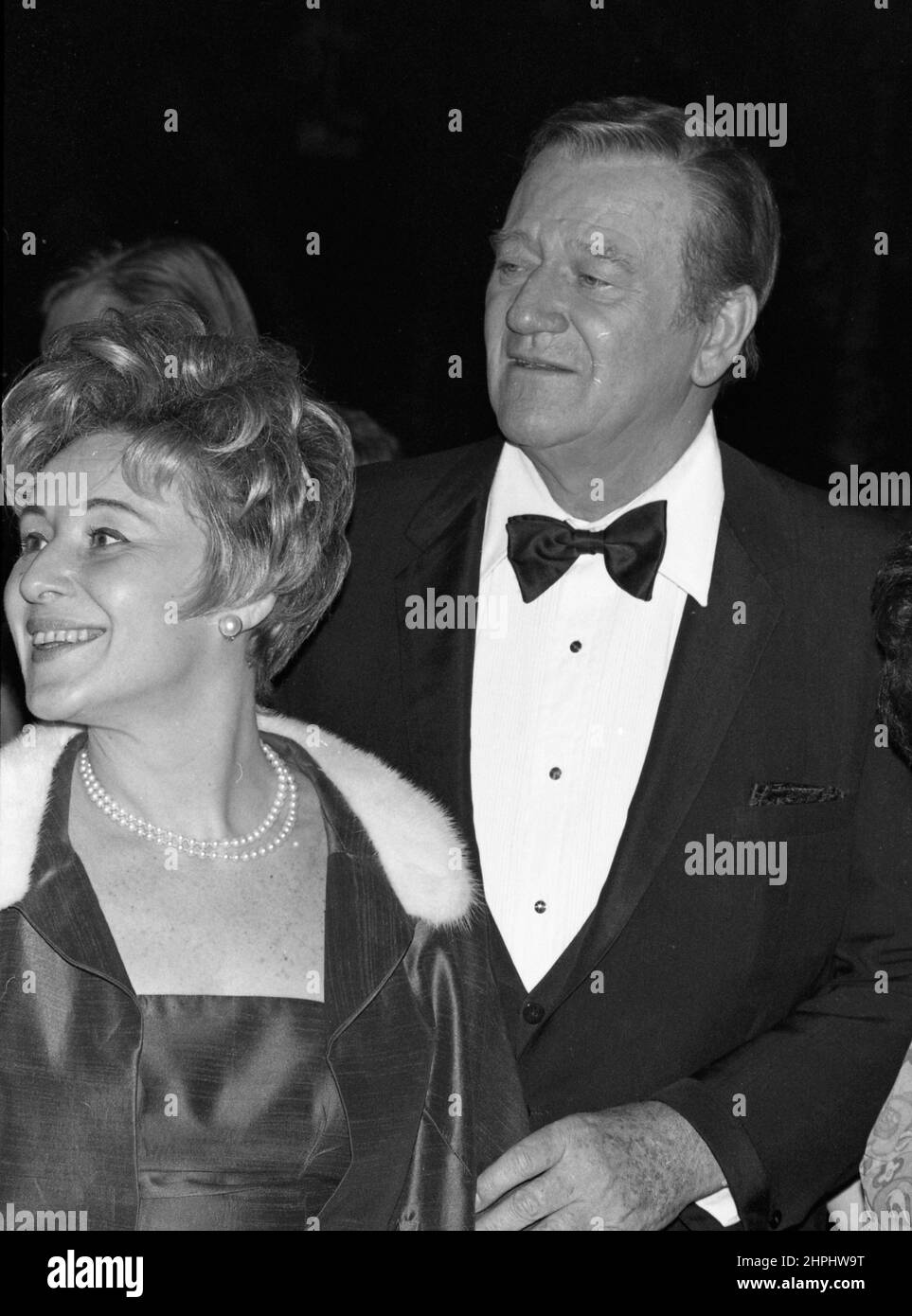 John Wayne and Yolanda Quinn at the 27th Annual Golden Globe Awards at ...