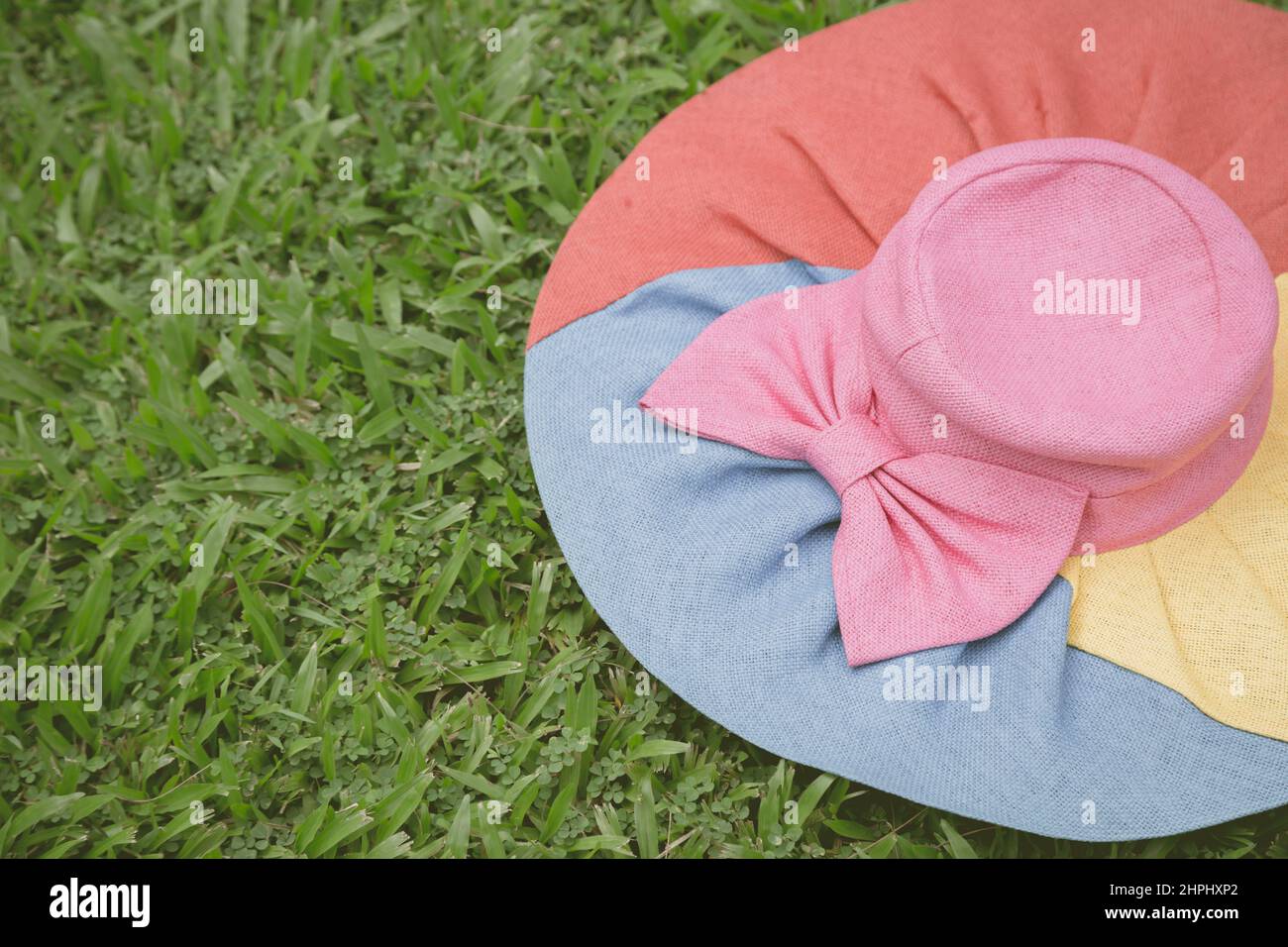 Colorful Hat on the lawn background Stock Photo - Alamy