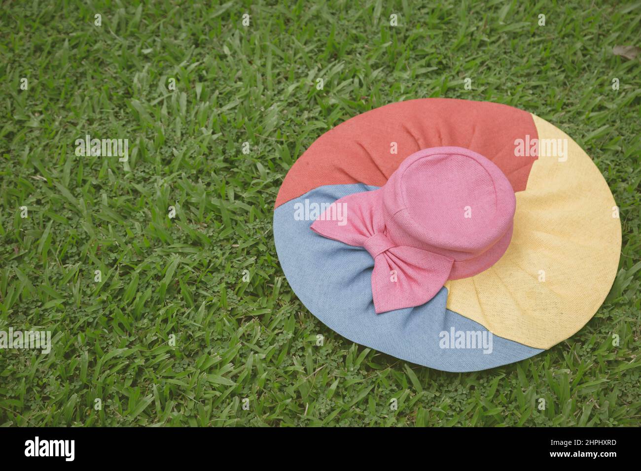 Colorful Hat on the lawn background Stock Photo - Alamy