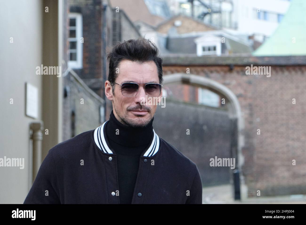 London, UK, 21st Feb, 2022. Model David Gandy poses for photographers outside the Paul & Joe catwalk show venue on day four of London Fashion Week. Credit: Eleventh Hour Photography/Alamy Live News Stock Photo