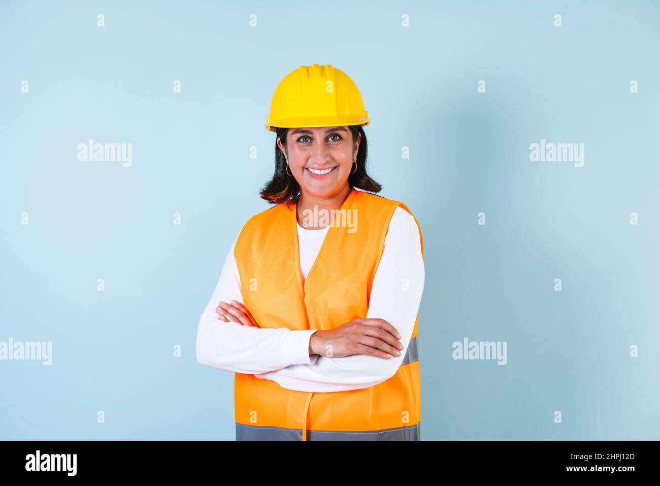 Hispanic woman Professional engineering and worker with helmet in Mexico Latin America Stock Photo